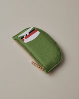 Small semi circle zippered wallet with cards partially visible