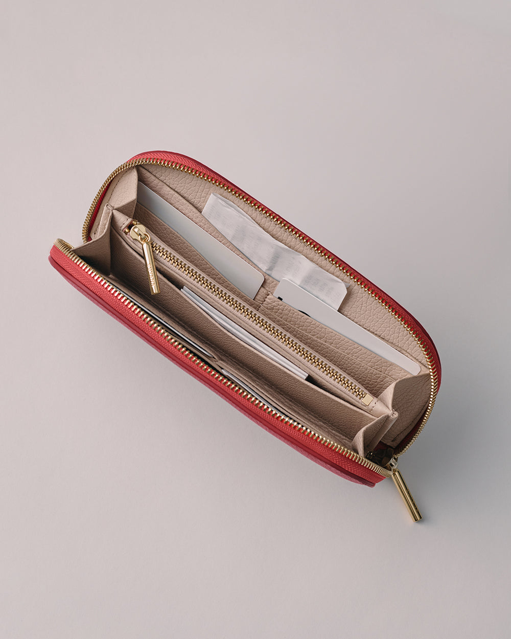 Curved Zip Wallet Open wallet with multiple compartments and a zipper pocket