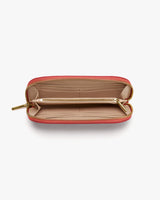 Open wallet with multiple compartments and a zipper.