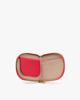 Open zippered wallet with card slots and a small pouch.