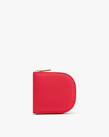 Compact leather zip wallet on plain background