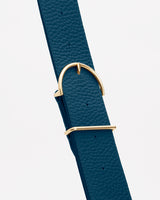 Textured belt with a gold buckle and loop.