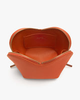 Open handbag with visible interior pocket and zipper closure.