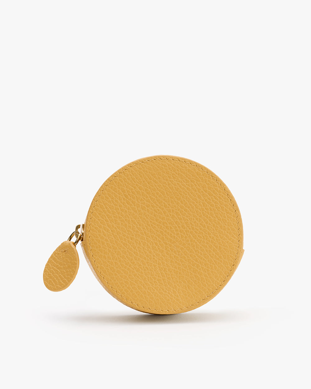 Round coin purse with a textured surface and a small attached zipper.