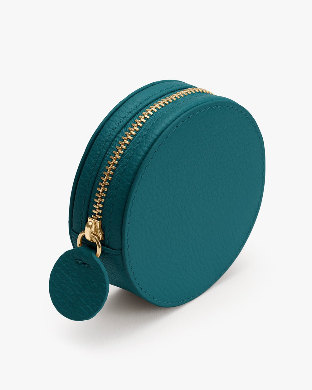Round zippered pouch with a circular pull tab.