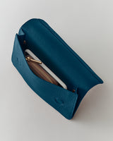 Open purse with visible zipper pouch and phone inside