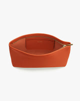 Open zippered pouch with visible interior pocket.