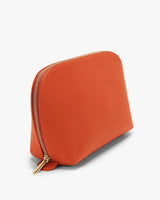 Zip pouch standing upright on a flat surface.