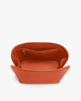 Open handbag with zippered pocket inside.