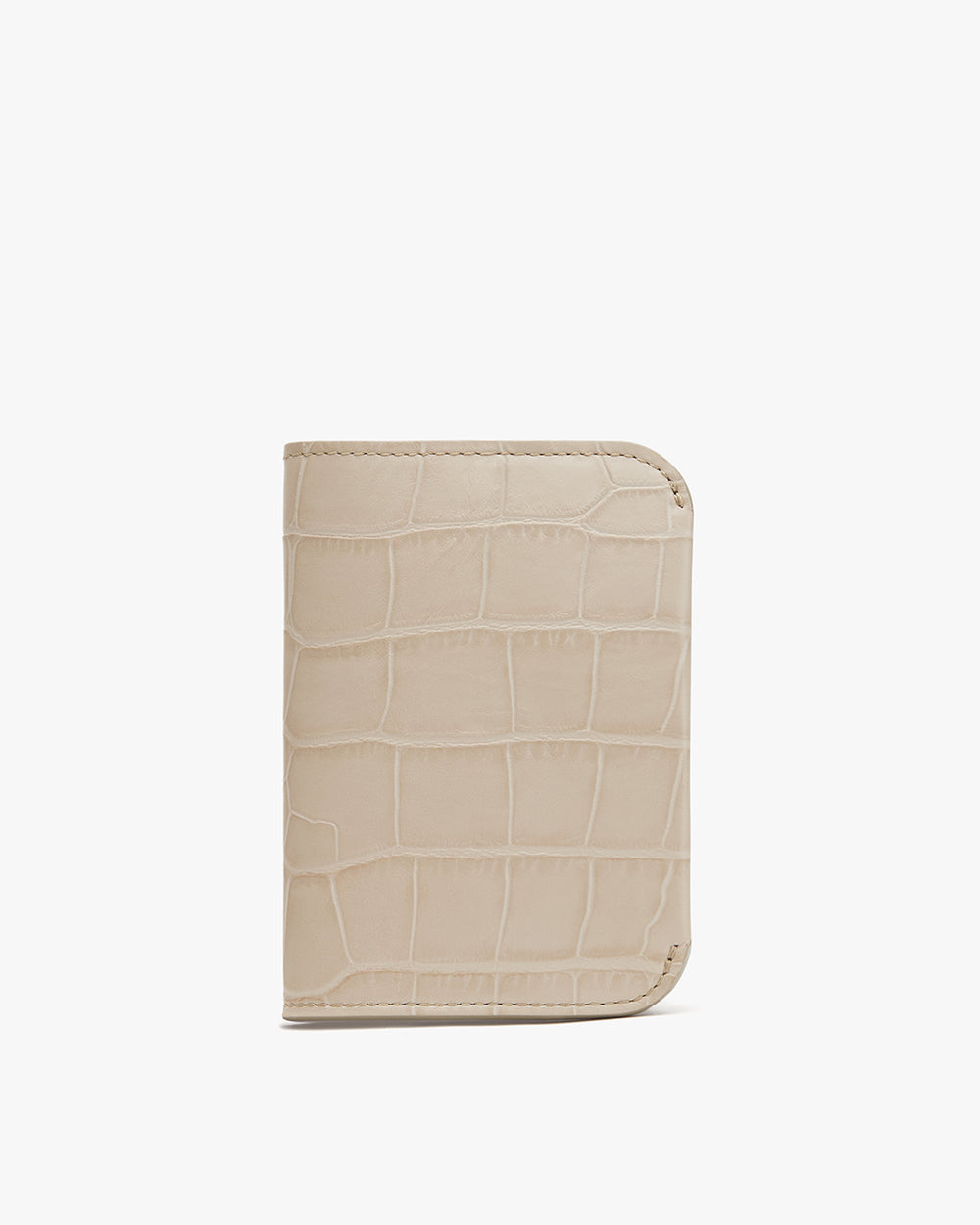 Wallet with textured exterior design on plain background.