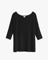 Blouse with a scoop neckline and three-quarter sleeves on a white background.