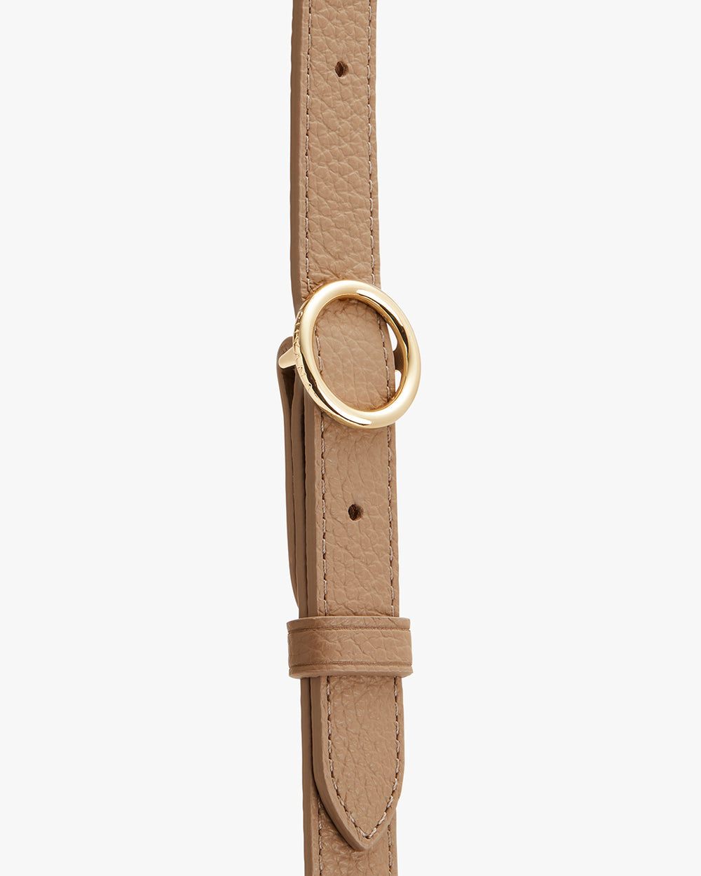 Adjustable Strap Leather strap with a circular metal buckle on it.