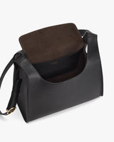 Open handbag with flap and shoulder strap.