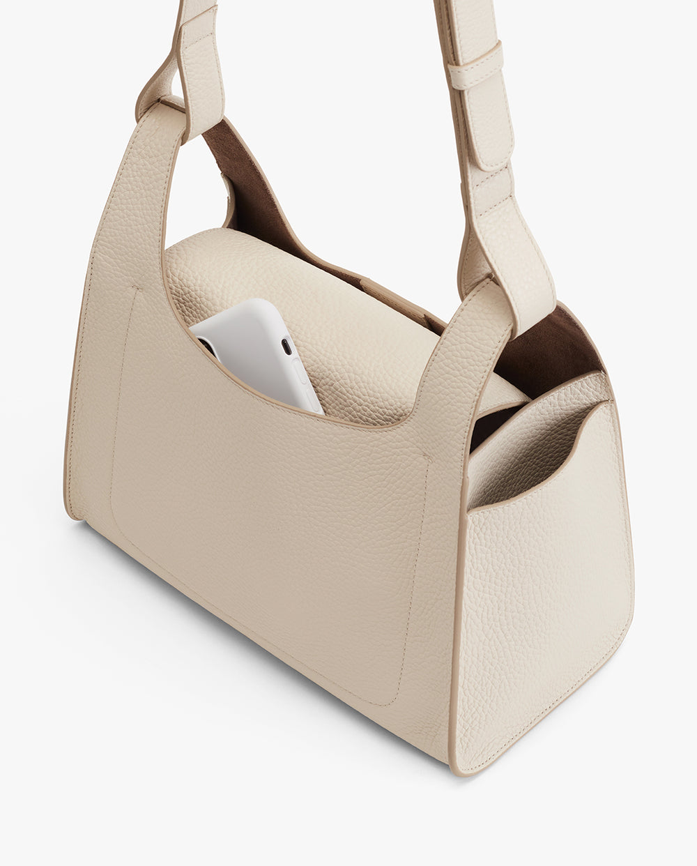 Double Loop Bag Handbag with a smartphone inside one of its pockets.