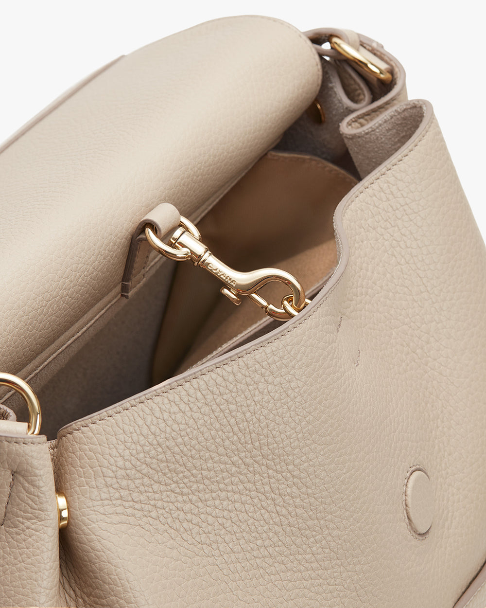 Open handbag with a clasp visible inside.