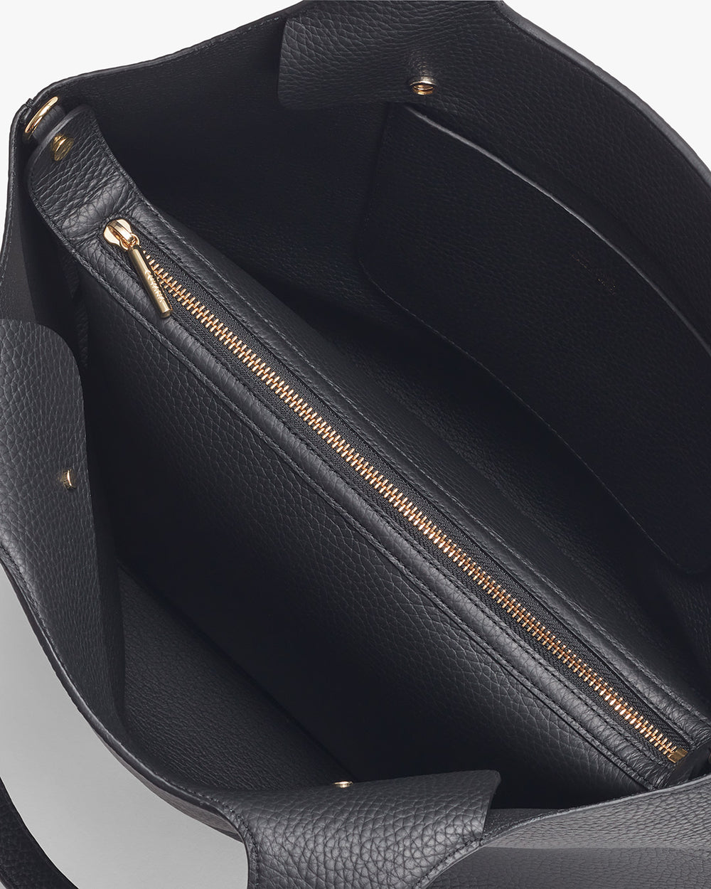 Open handbag with interior zipper pocket visible.