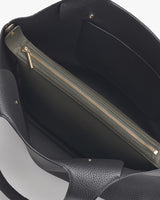 Open handbag with an interior zipper pocket.