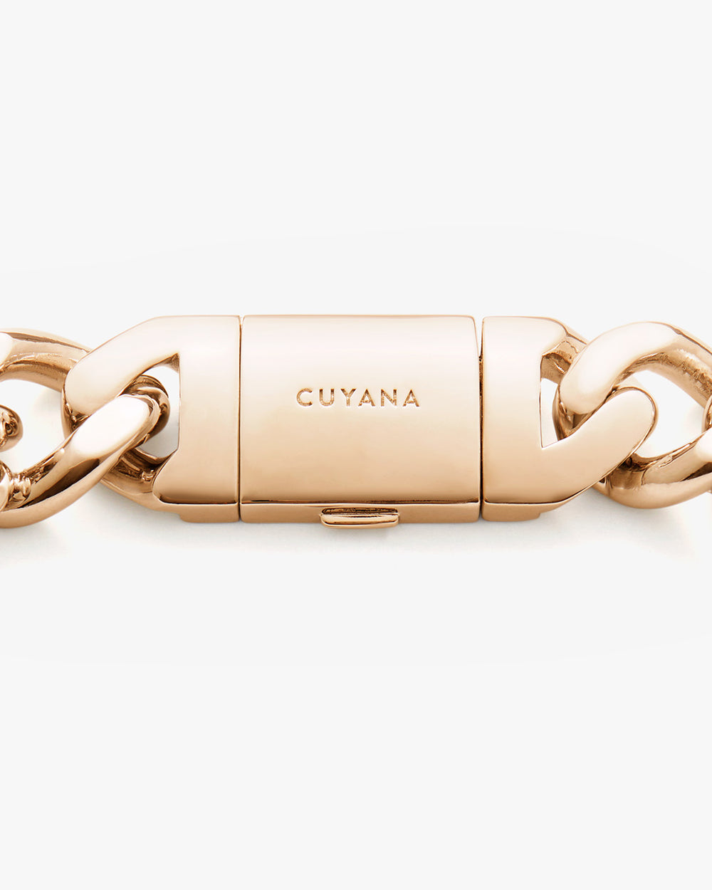 Close-up of a bracelet clasp with engraved brand name.