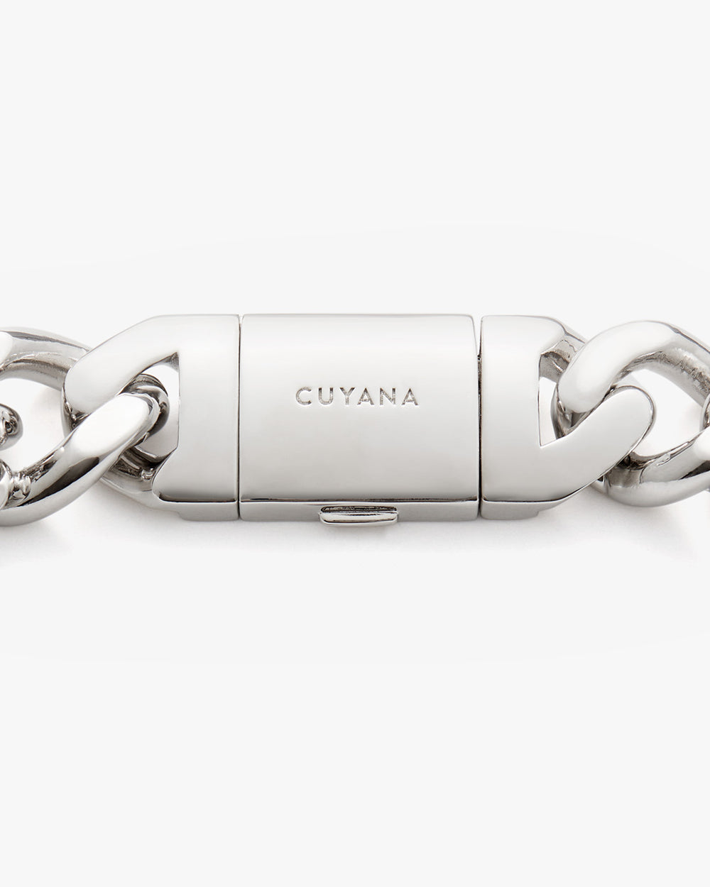Close-up of a metal clasp on a chain with engraved branding.
