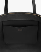 Open tote bag with a visible inner pocket and zipper closure.