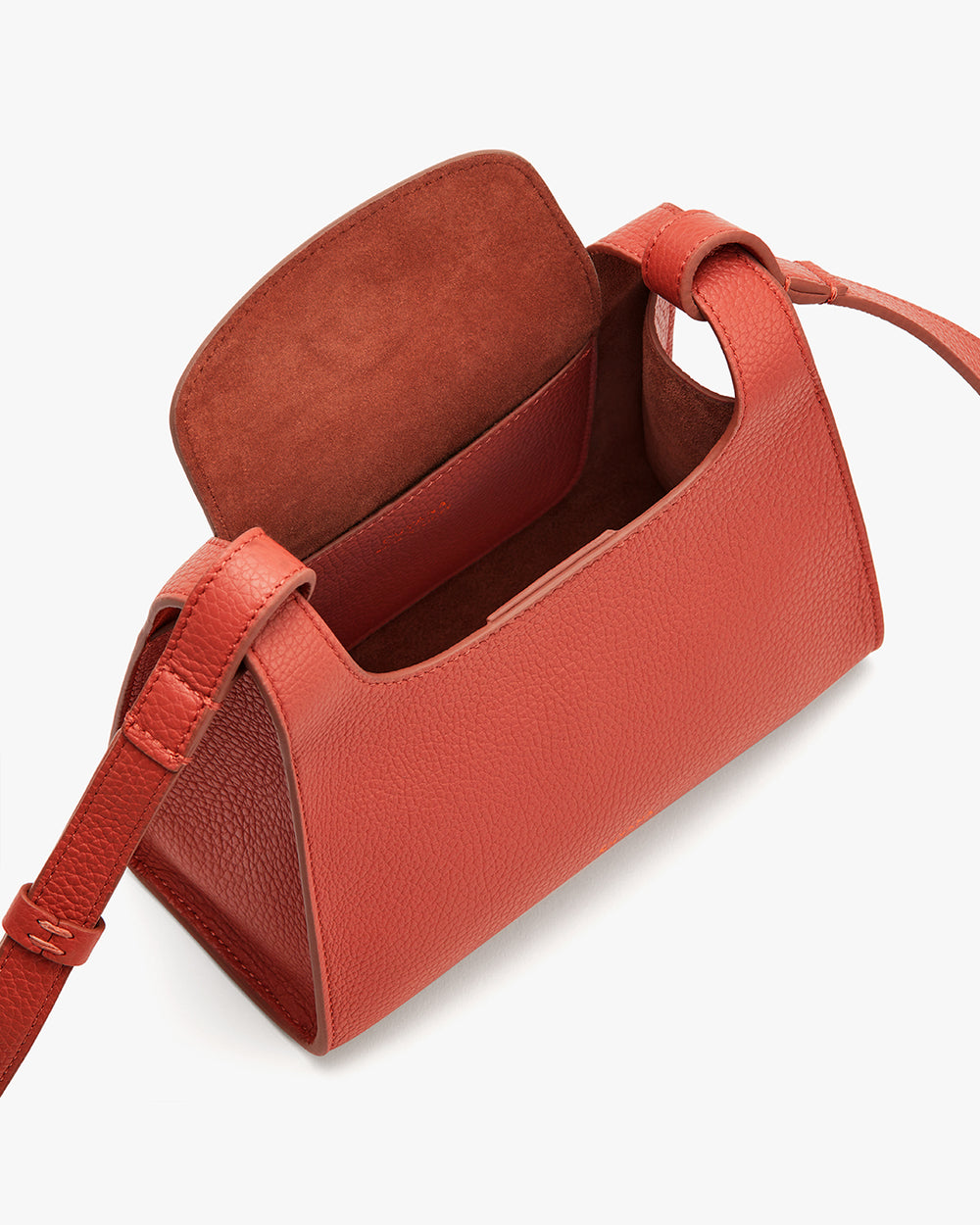 Open handbag with visible interior and adjustable strap.
