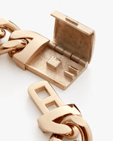 Close-up of an open clasp on a chain link.