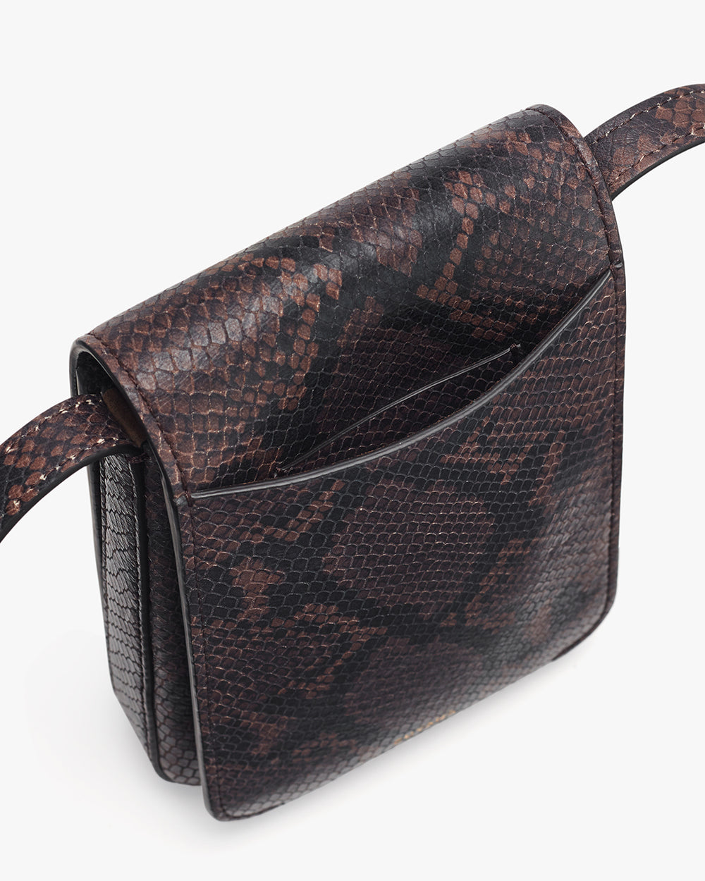 Small textured shoulder bag with a flap closure