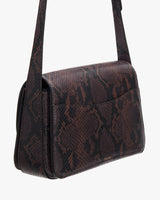 Small patterned shoulder bag against a plain background