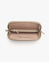 Open wallet with multiple compartments and a zipper closure.