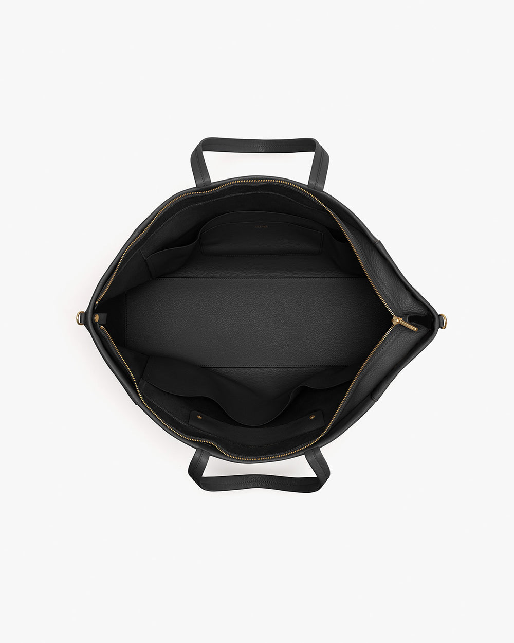 Top view of an open travel bag showing internal compartments and handles.