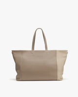 Large tote bag with two handles standing upright.