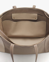 Open leather bag viewed from above.