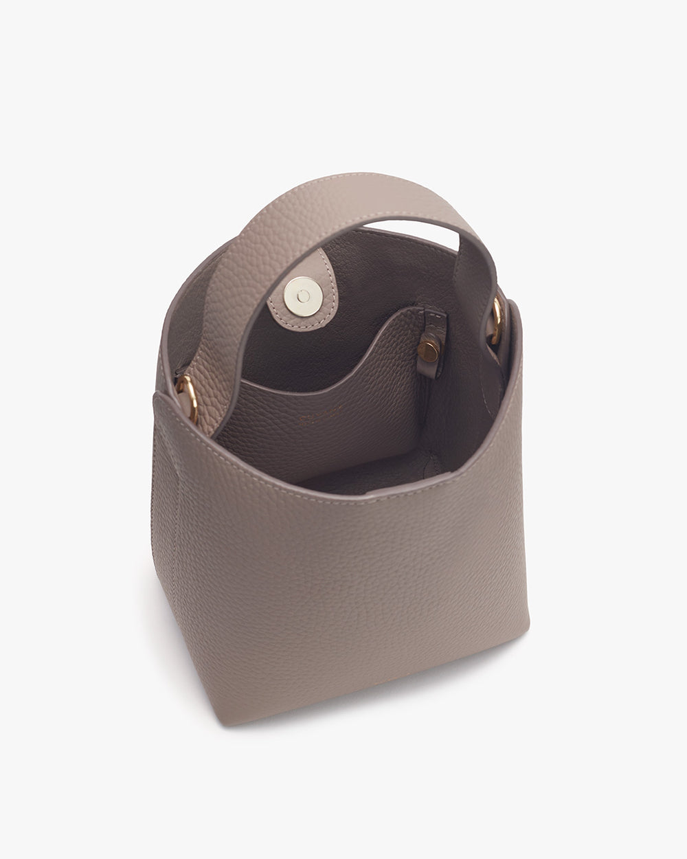 Open handbag with visible interior snap button closure