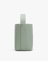 Backpack with single grab handle and visible stitching detail.