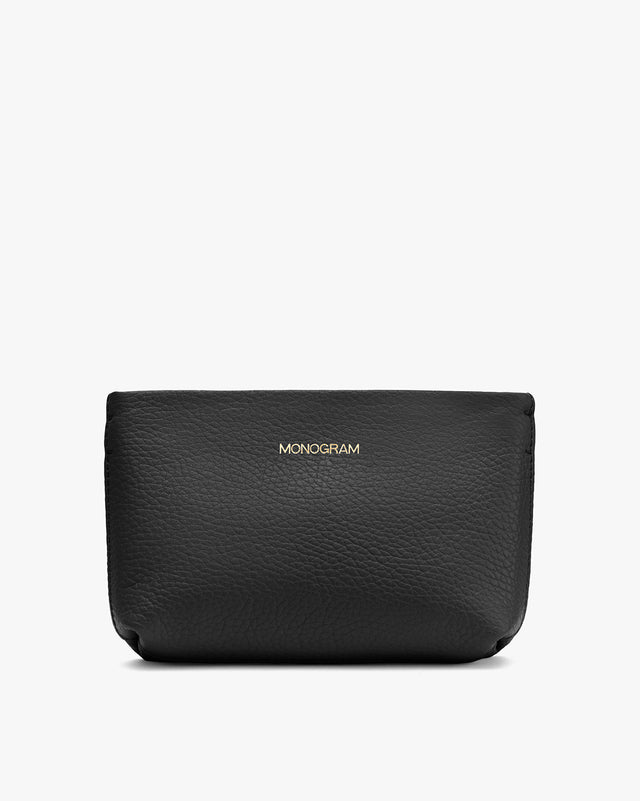 Black textured pouch with the word MONOGRAM embossed on it.