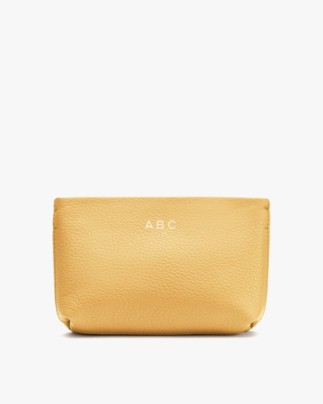 Cosmetic bag with initials A.B.C on the front.