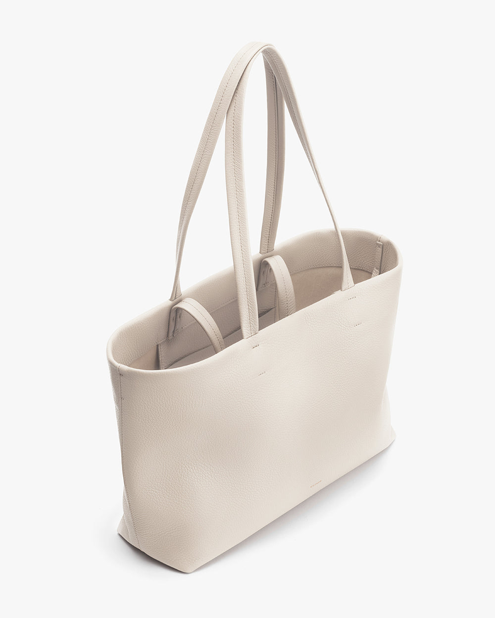 Tall tote bag with two handles standing upright.