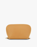 Small zippered pouch standing on a flat surface.