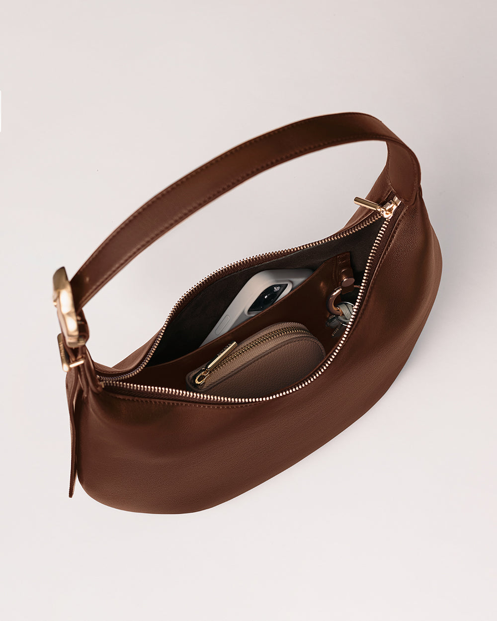 Open handbag with phone and wallet inside