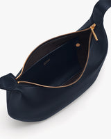 Open bag with visible zipper and interior pocket.