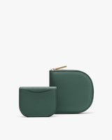 Two simple wallets placed side by side. The larger one with zipper