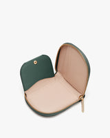 Small zipped pouch opened wide on a light surface