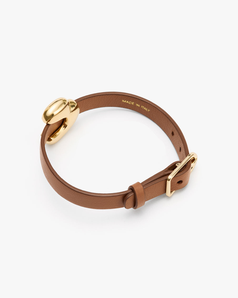 Celestia Leather Bracelet Leather bracelet with a round metal accent and adjustable buckle.