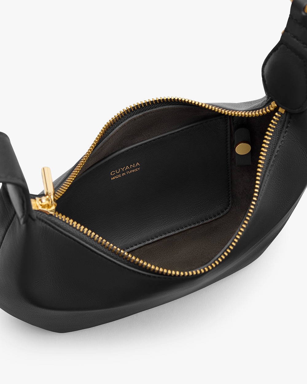 Open handbag with visible interior pocket and zipper.
