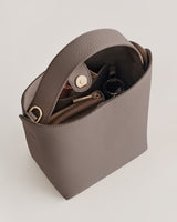 Open handbag with wallet and small pouch inside