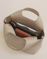 Open handbag with a wallet and zipper pouch inside