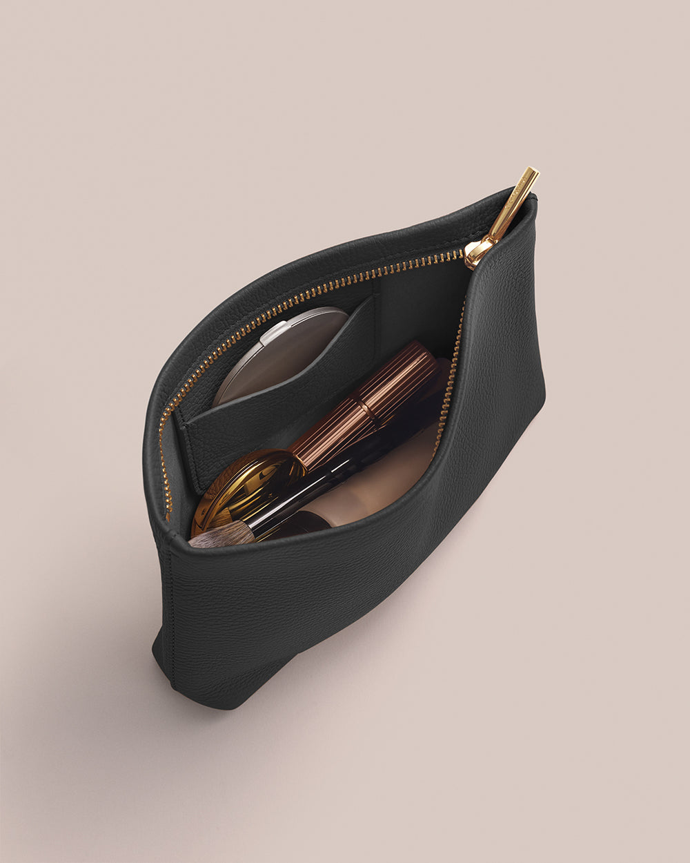 Open zipper pouch with cosmetic items inside.