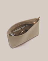 Open pouch with zipper, containing a card, perfume and a compact mirror.