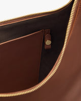 Open travel bag with pocket and zipper detail.