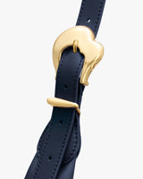 Leather strap with a gold buckle detail